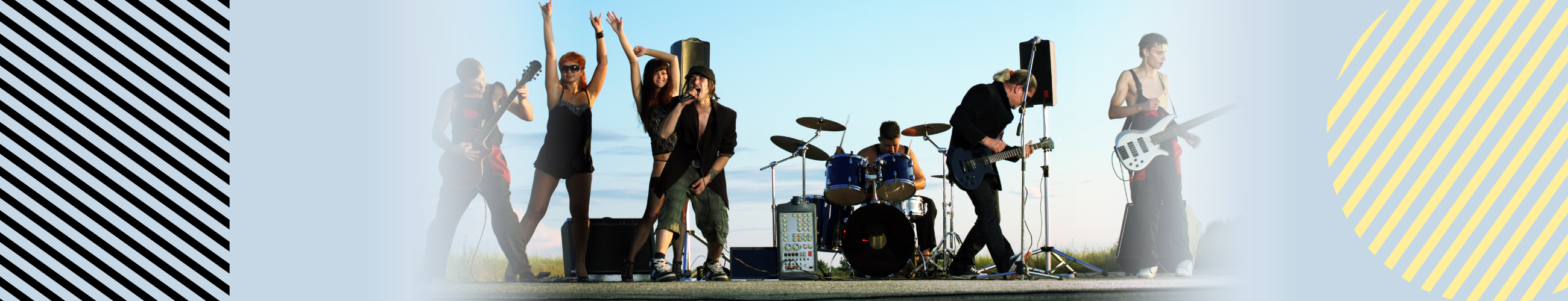 7 people in a rock band playing on a stage with blue sky in the background.