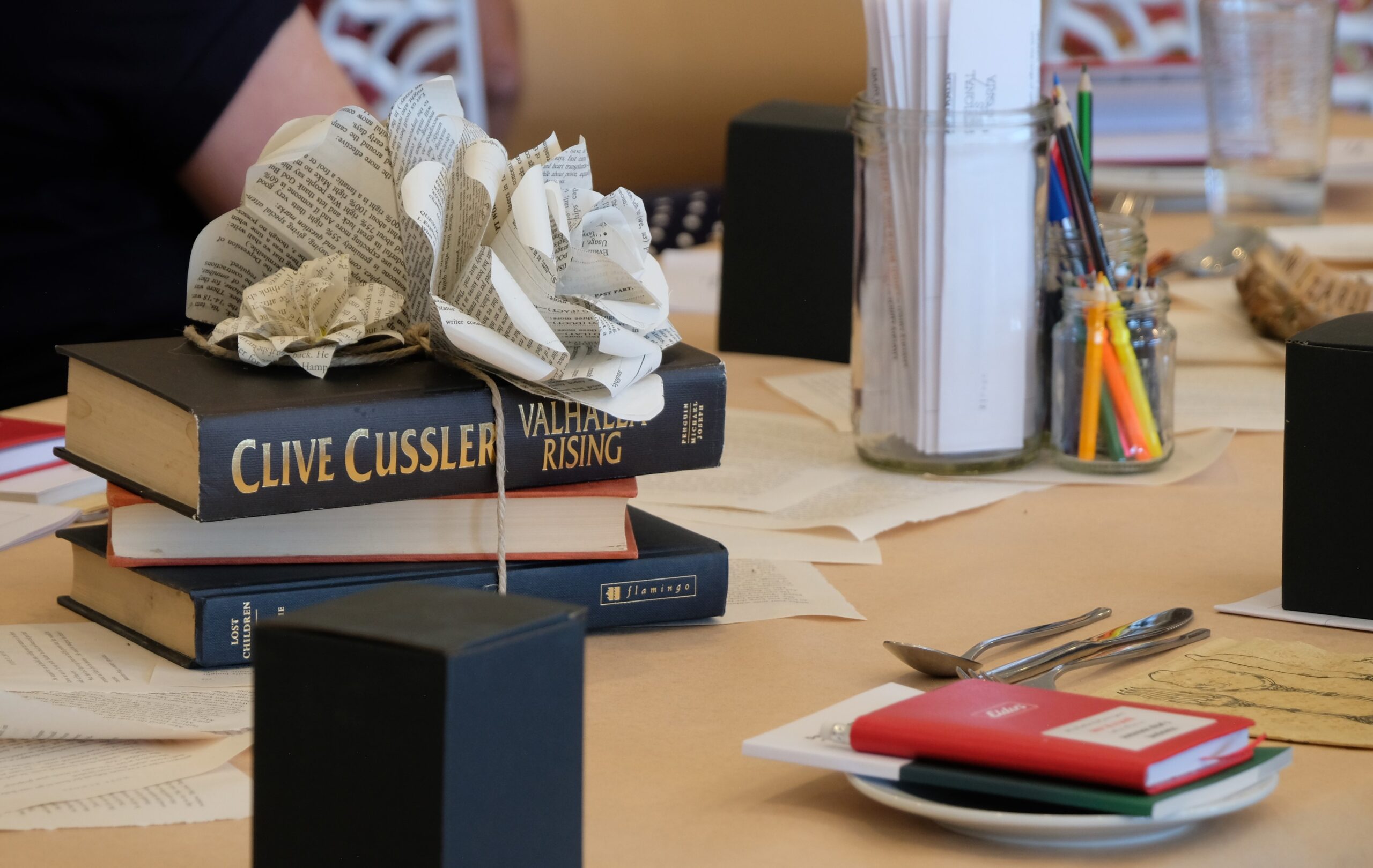 Books and pens on a table